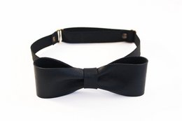 Black bow tie with a sleek, formal design. Made of high-quality materials for a sophisticated look.