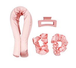 Satin heatless curlers in a soft pink color, including a headband, scrunchies, and a hair clip for creating effortless curls without heat damage.