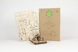 Wooden pyramid-shaped puzzle kit with laser-cut pieces and instructions. Designed for assembly and display.