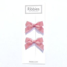 Red and white striped satin hair bows, perfect for kids' hair accessories.