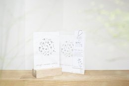 Wildflower greeting cards featuring delicate floral illustrations in black and white. The cards showcase various blooming flowers and plants in a minimalist, botanical style.