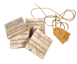  Vintage-style coasters featuring sheet music design, tied together with twine and a price tag.