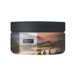 A sea salt body scrub from the Shinshiro brand, featuring 450 grams of product. The scrub is designed to exfoliate and nourish the skin, with a focus on natural ingredients and a scenic landscape design on the packaging.