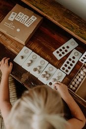 Wooden blocks with numbers for learning to count, part of a Montessori-style educational toy set. The blocks feature various shapes and colors to help children develop counting and numeracy skills.