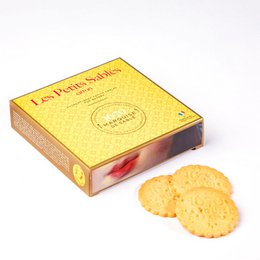 Lemon chip shortbread cookies in a 100g cardboard box. The box has a yellow and red design with a circular logo.