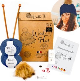 This knitting kit includes everything needed to create a warm, stylish hat. The kit contains blue wool yarn, knitting needles, and detailed instructions to guide you through the DIY project. The finished hat is suitable for both children and adults.