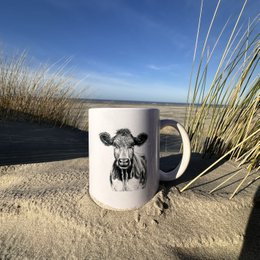 A white ceramic mug featuring a detailed illustration of a starfish against a blue background, surrounded by seashells and other beach elements.