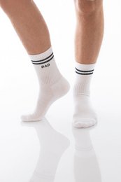 White socks with "DAD" text, suitable for fathers. Comfortable cotton material, available in multiple sizes.