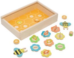 Wooden puzzle game with bees, flowers, colorful pieces, educational toy for children, natural wood box storage.