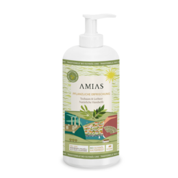 A 500ml bottle of tea tree and bay laurel liquid hand soap from the Amias brand. The soap is green in color and has a pump dispenser.