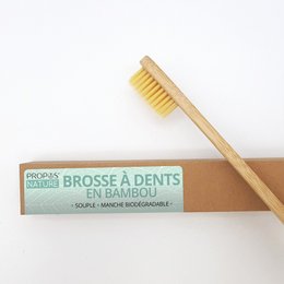 Bamboo toothbrush with natural bristles, eco-friendly and sustainable dental care product.