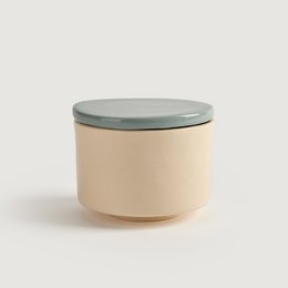  Stoneware storage box in beige, blue, and green colors. Cylindrical shape with a lid. Suitable for storing various items.