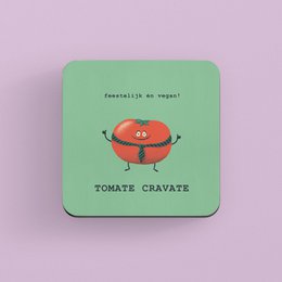 Coaster with a tomato-shaped character and the text "Tomato cravate" in a playful, illustrated style. The coaster appears to be made of a durable material, likely cork or wood, and has a green background.