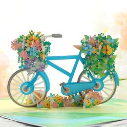 Colorful 3D pop-up birthday card with a floral bicycle design, perfect for celebrating a special occasion.