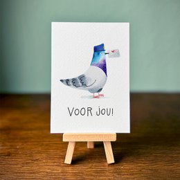 A colorful postcard featuring an illustrated pigeon with the text "Voor jou" (For you). The pigeon has a vibrant blue and purple color scheme, suggesting a modern, artistic style.