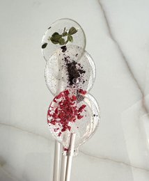Sugar-free lollipops with freeze-dried berries in various colors and shapes.