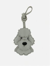 Gray plush Schnauzer dog bag charm with a cute, friendly expression.
