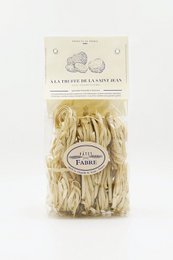  Tagliatelle pasta nests, golden yellow color, truffle flavored, dried pasta product, Italian cuisine ingredient.