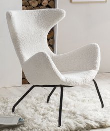 Plush white armchair with teddy fur upholstery and curved, modern design.