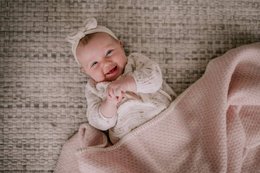  Soft, pink wool crib blanket for babies. Cozy and comfortable for newborns.