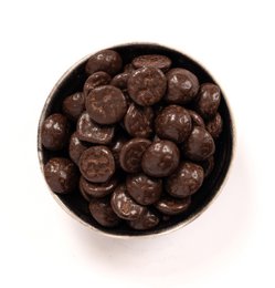 Ginger-flavored gingerbread nuts in a round container. The nuts have a dark brown color and appear to be coated in a ginger-flavored glaze or coating.