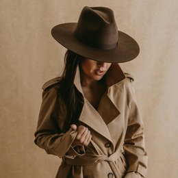 Brown felt fedora hat with wide brim, suitable for casual or formal wear.