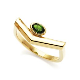 Pioneering ring in gold with a green oval gemstone. The ring features a bold, modern design with a sleek, minimalist style.