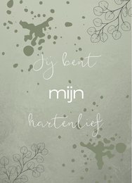 A postcard with the text "Jy bent mijn hartenlief" (You are my sweetheart) against a light green background with floral patterns and splatters.