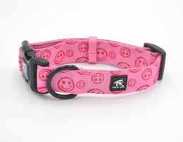 A pink dog collar with a repeating heart pattern. The collar appears to be made of a durable material and has a sturdy metal buckle closure.