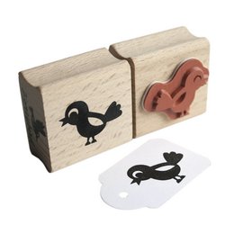 A small, wooden rubber stamp featuring a simple, black silhouette of a little bird. The stamp can be used to create decorative patterns or images on various surfaces.