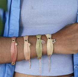  Delicate charm bracelet with a variety of color options, featuring a tree of life charm.