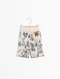 Patterned kids' shorts in a beige and black color scheme. The shorts feature a cactus print design and are available in sizes 2-3Y, 4Y, 6Y, 8Y, and 10Y.