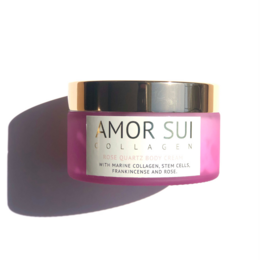 Rose quartz collagen cream in a pink jar with gold accents. The cream appears to be a soft, creamy white color.