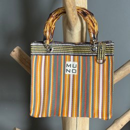  Striped tote bag with bamboo handles in sunset colors.