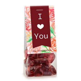 Vegan gummy snack bag with "I Love You" text and floral design on packaging. Contains red gummy candies.