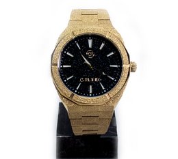Gold-tone stainless steel watch with black dial and analog display.