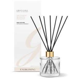  A glass bottle reed diffuser with a floral and citrus scent. The diffuser features a clear glass bottle with a gold cap and black reed sticks. The product is described as having a nectarine blossom and grapefruit fragrance.