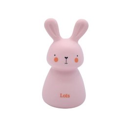 A pink, battery-powered rabbit-shaped night light for kids' rooms. The light has a timer and is easy to recharge.