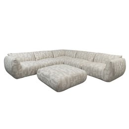  Large, L-shaped sectional sofa with ottoman in a modern, geometric pattern. Upholstered in a light, neutral-toned fabric. Provides ample seating for 6 people. Suitable for living rooms or family rooms.