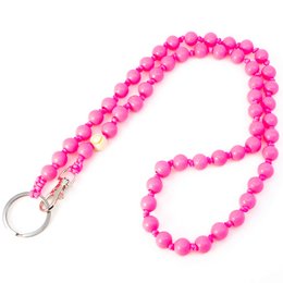 A long, pink beaded keychain with a metal ring.