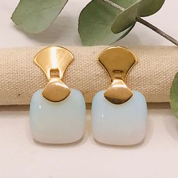 Frameless square gemstone earrings in opalina color with gold-tone accents. Stud earring style.