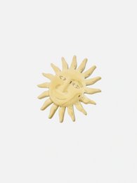 Gold sun face statement ring with a bold, eye-catching design.