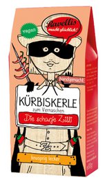 Dark chocolate-coated pumpkin seeds with a chili kick, packaged in a vibrant, illustrated box.