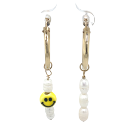  Gold-filled hoop earrings with a pearl and a smiley face charm, perfect for adding a touch of whimsy to any outfit.