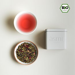 Organic tea blend with holy basil and moringa, packaged in a white container.