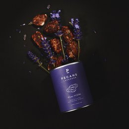 Pecan and lavender flavored covered nuts in a 50g tin. The nuts have a rich, nutty flavor with a hint of lavender aroma.