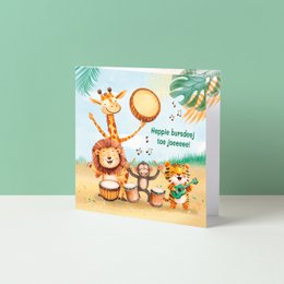  Colorful birthday card with cartoon animal characters, tropical leaves, and a sun. The card has a playful, whimsical design suitable for a birthday celebration.