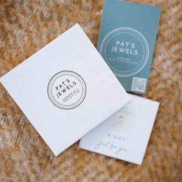  Turquoise drop earrings with a gold-tone finish. The earrings feature three oval-shaped turquoise stones arranged vertically for a chic, elegant look.