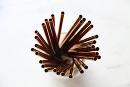 Extra long brown paper straws, pack of 50, for drinking beverages.