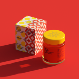 Greek organic honey and propolis in a glass jar with a red and yellow patterned label.